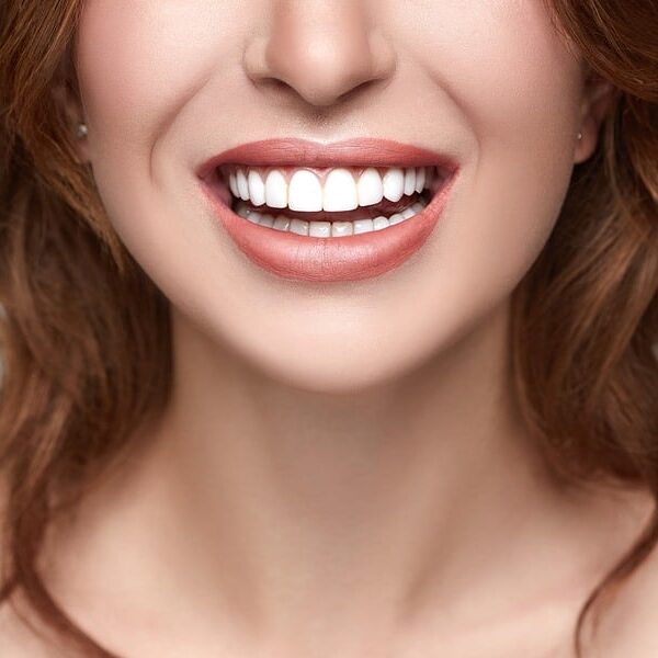 a close up of a woman's white teeth