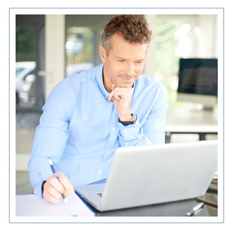 a man looking at a computer screen