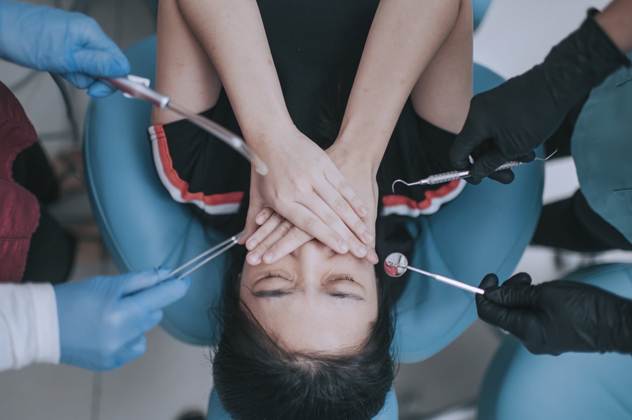 Patient with dental anxiety at the dentist