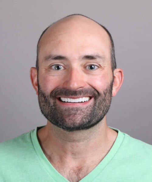 a man smiling for the camera