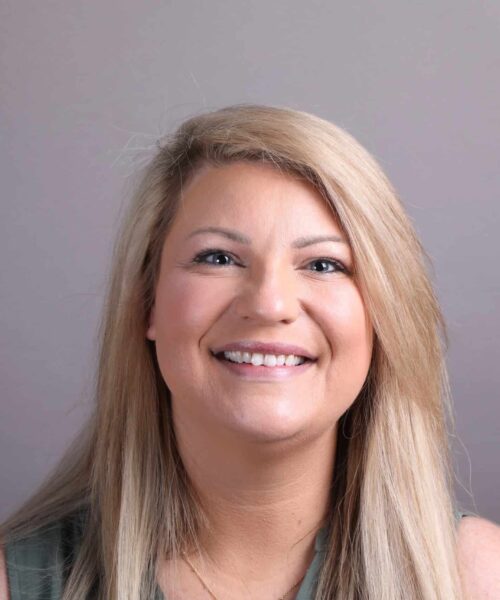 a woman smiling for the camera
