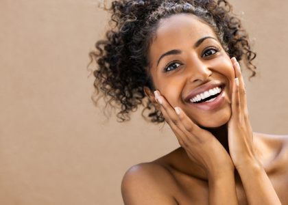 A patient with a bright, sparkly smile is thrilled after a comfortable dental spa treatment in Birmingham, AL.