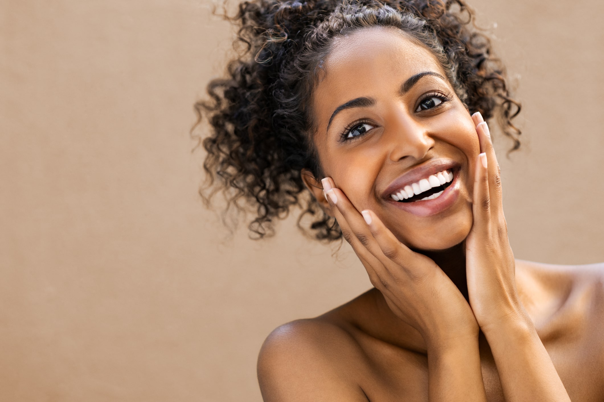 A patient with a bright, sparkly smile is thrilled after a comfortable dental spa treatment in Birmingham, AL.